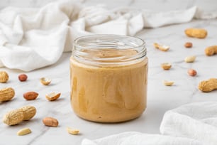 a jar of peanut butter sitting on top of a table