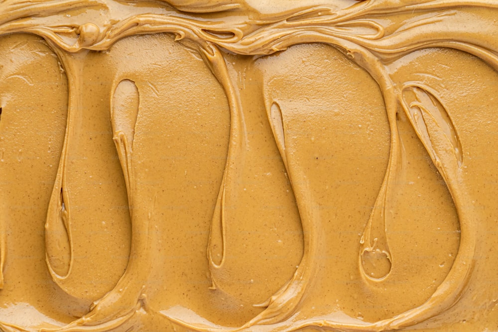 a close up of a cake with peanut butter frosting