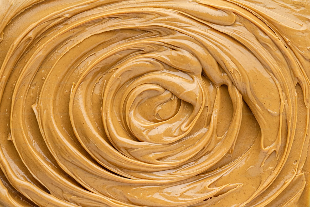 a close up of a bowl of peanut butter