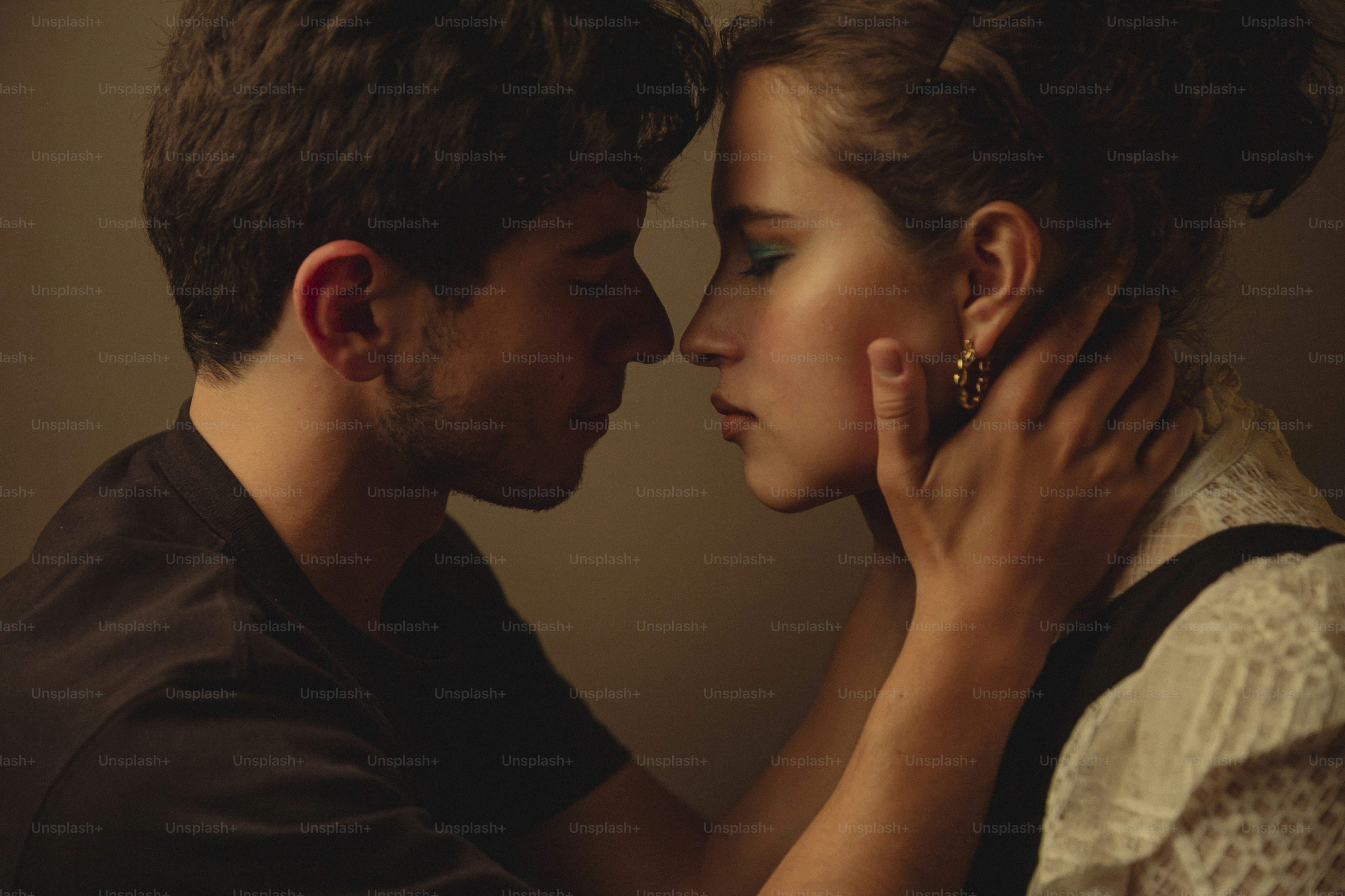 a man and a woman kissing each other