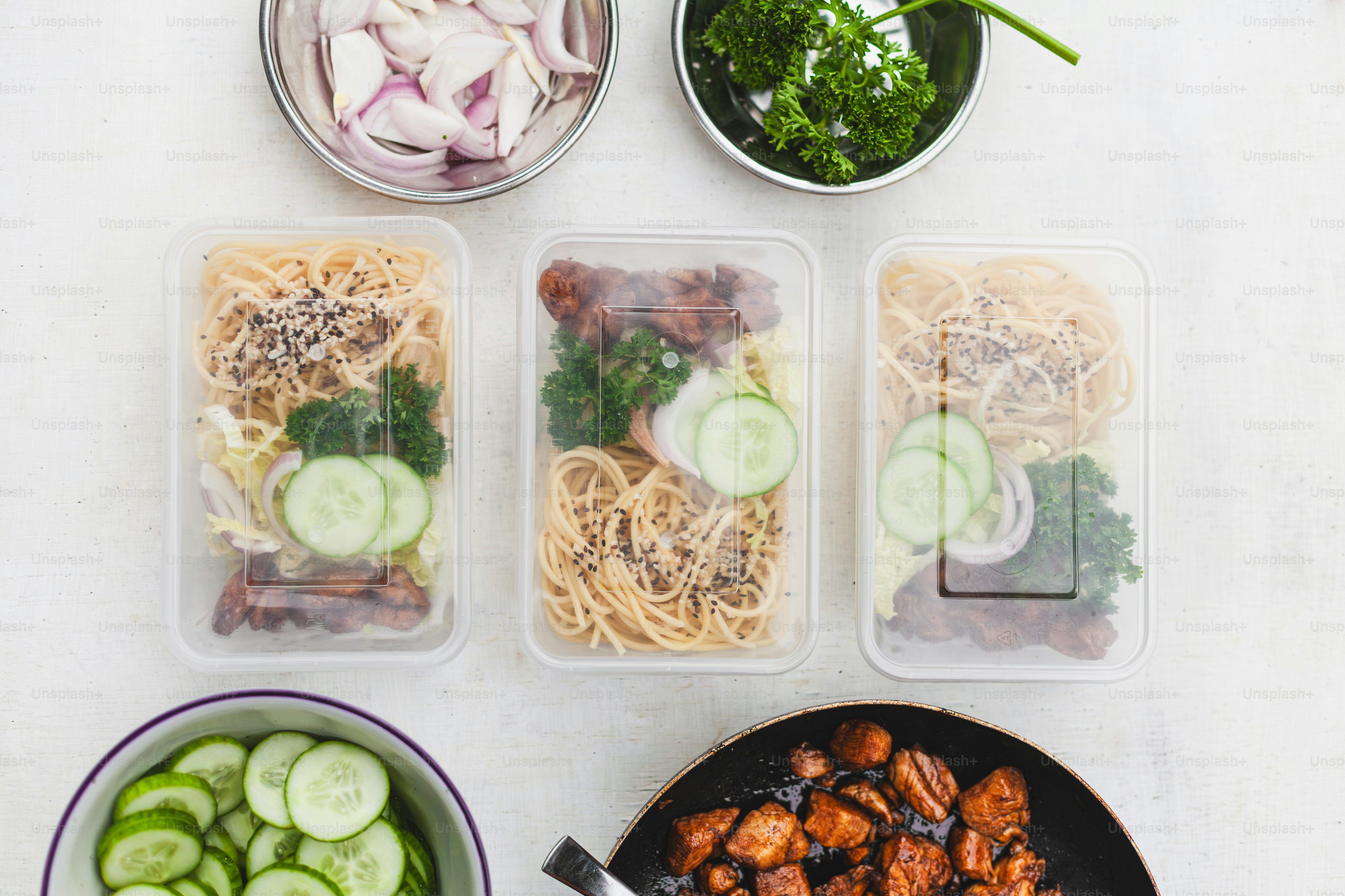 Meal prep containers showing foods that help avoid muscle growth nutrition mistakes