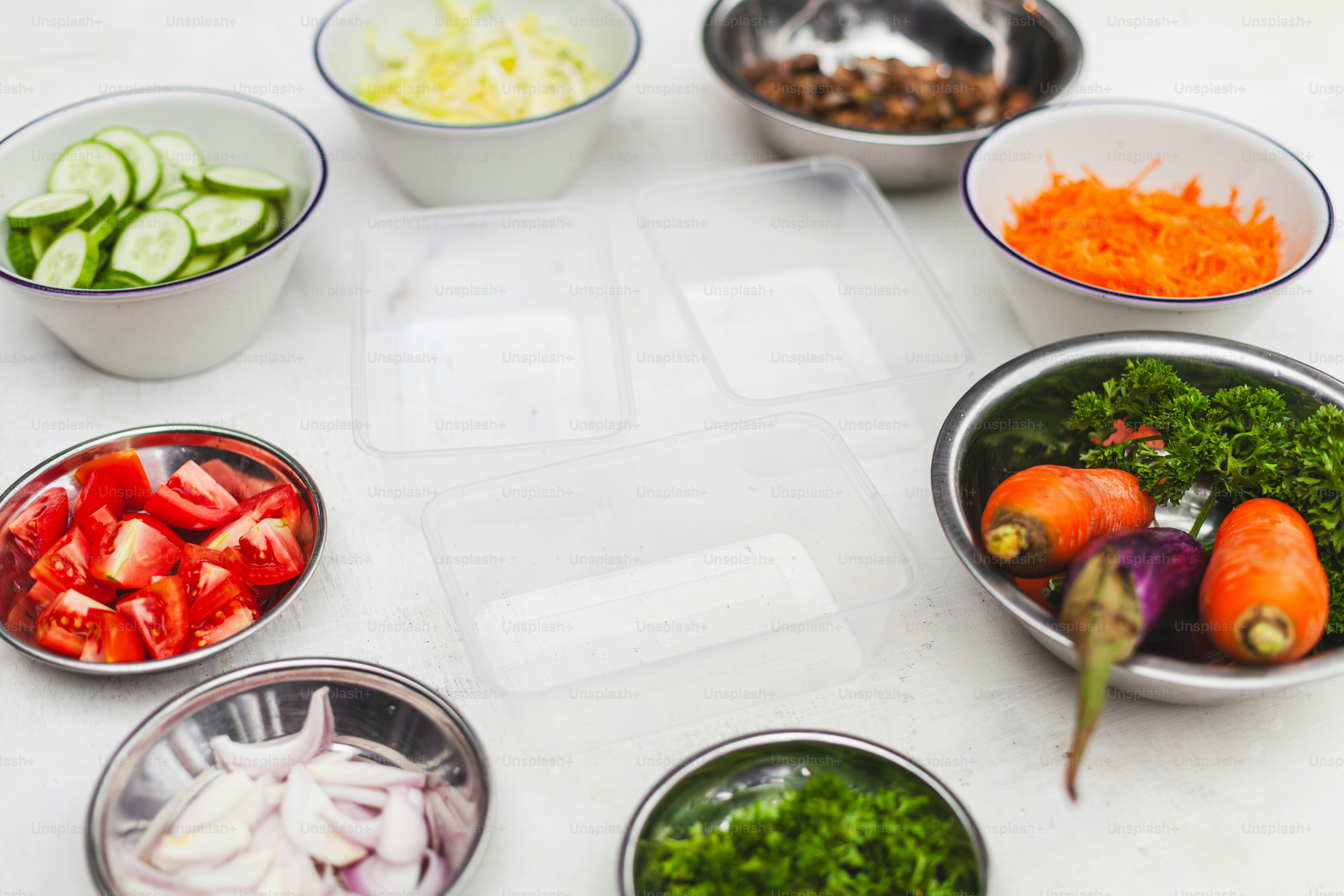 a table topped with bowls filled with different types of vegetables
