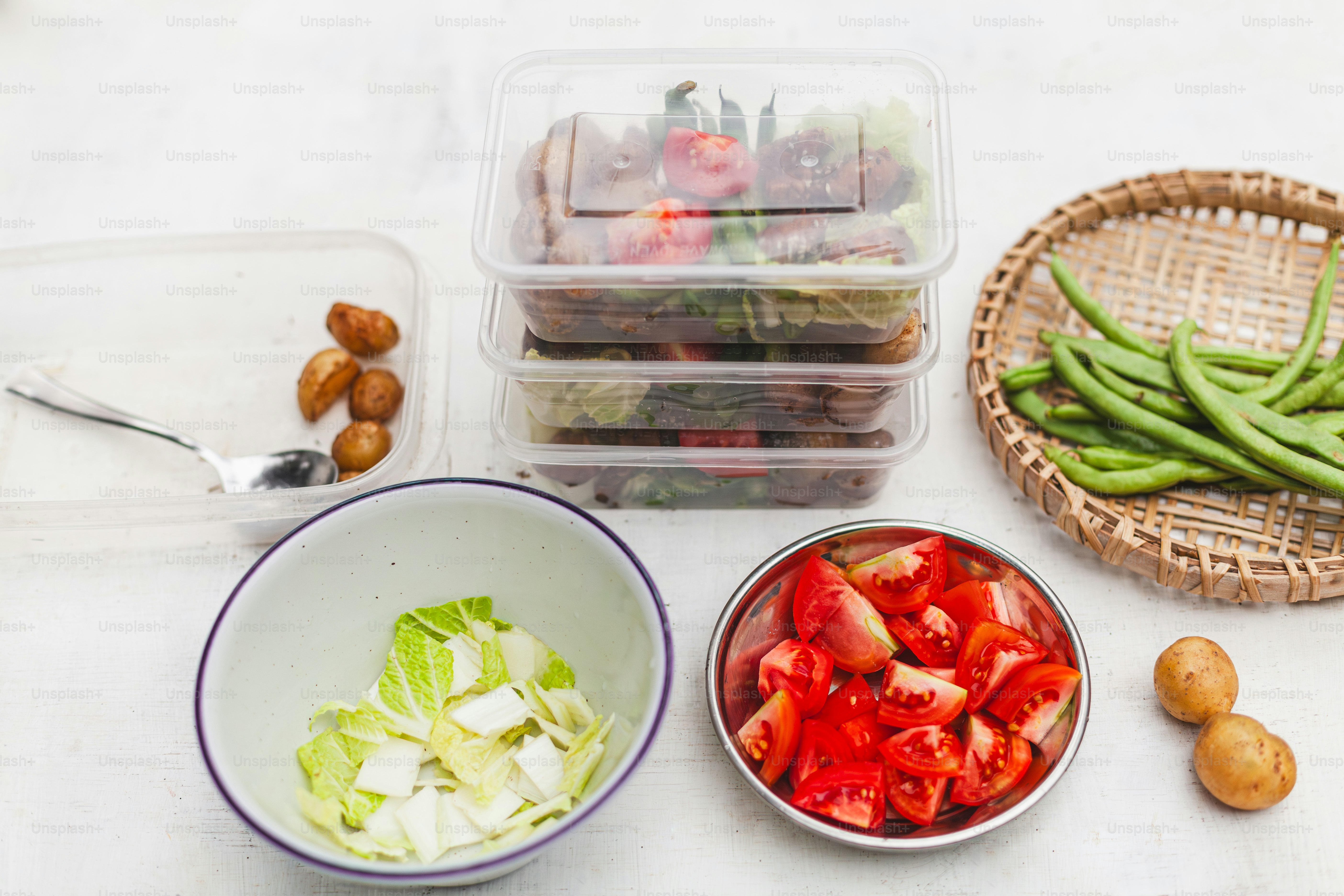 a table topped with bowls filled with vegetables