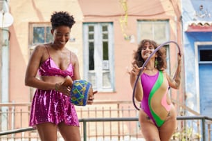 a couple of women in bathing suits standing next to each other
