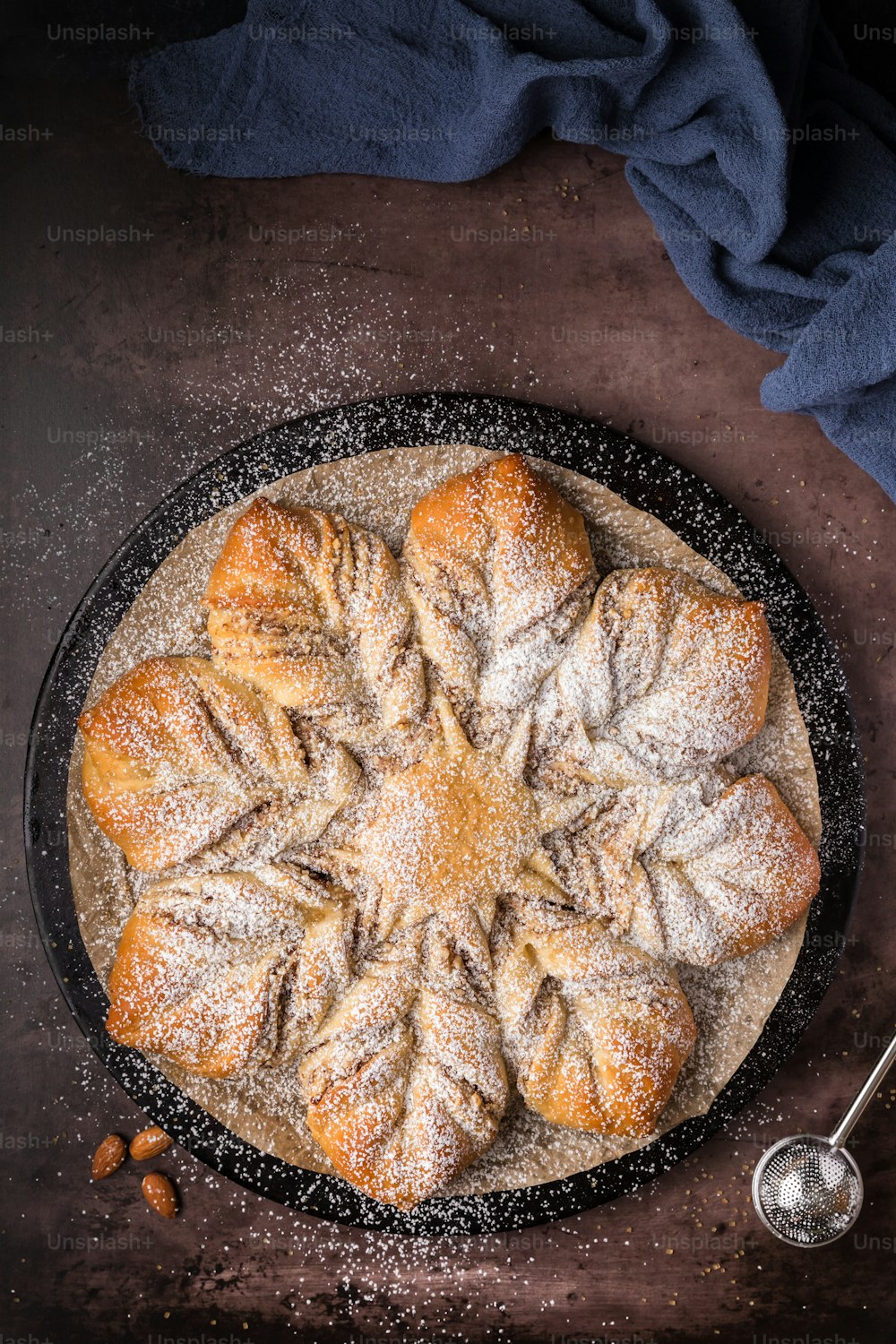 a cake with powdered sugar on top of it