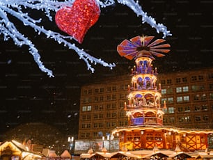 a large building with a tower with lights on it