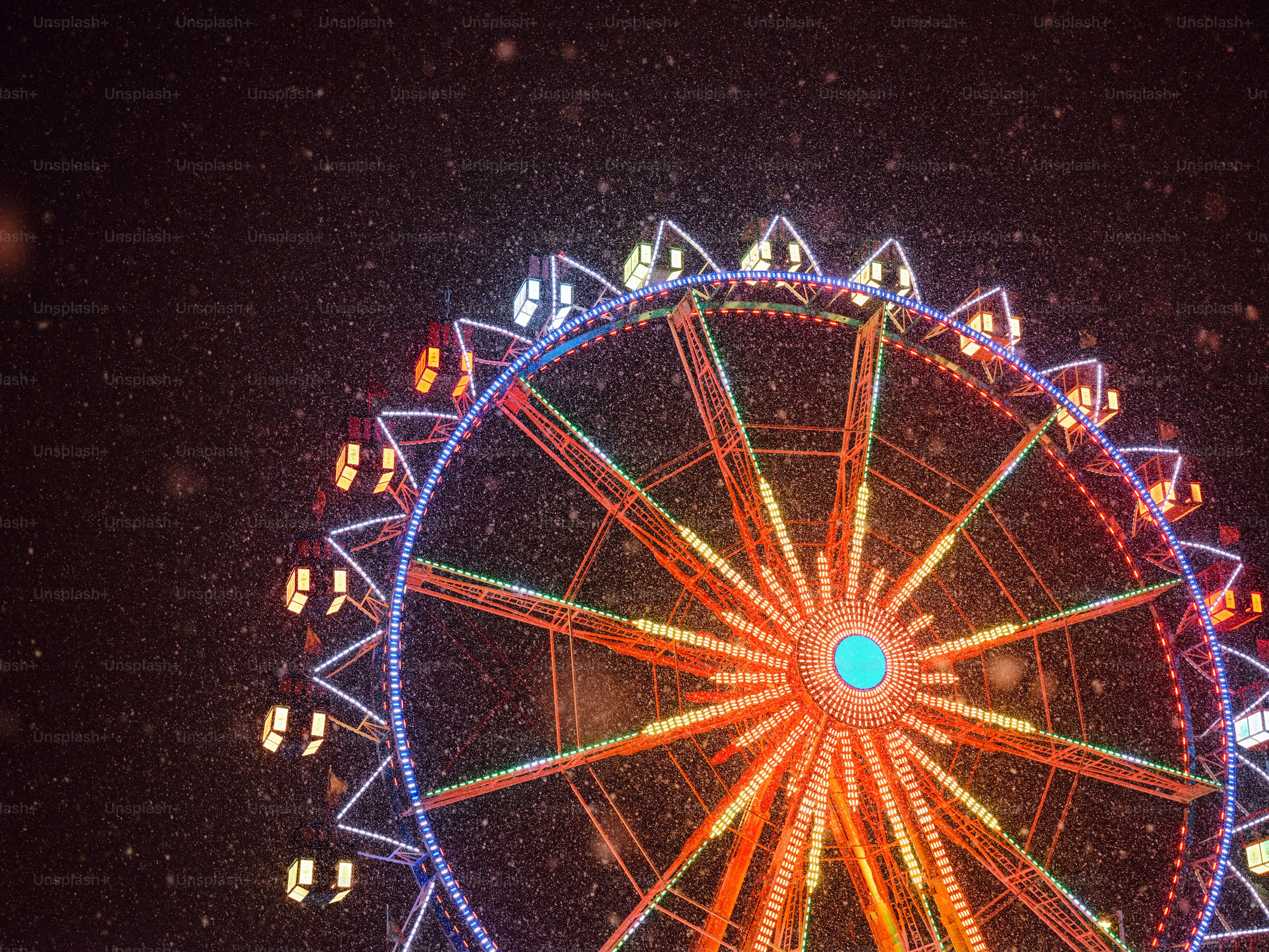 a large ferris wheel lit up at night