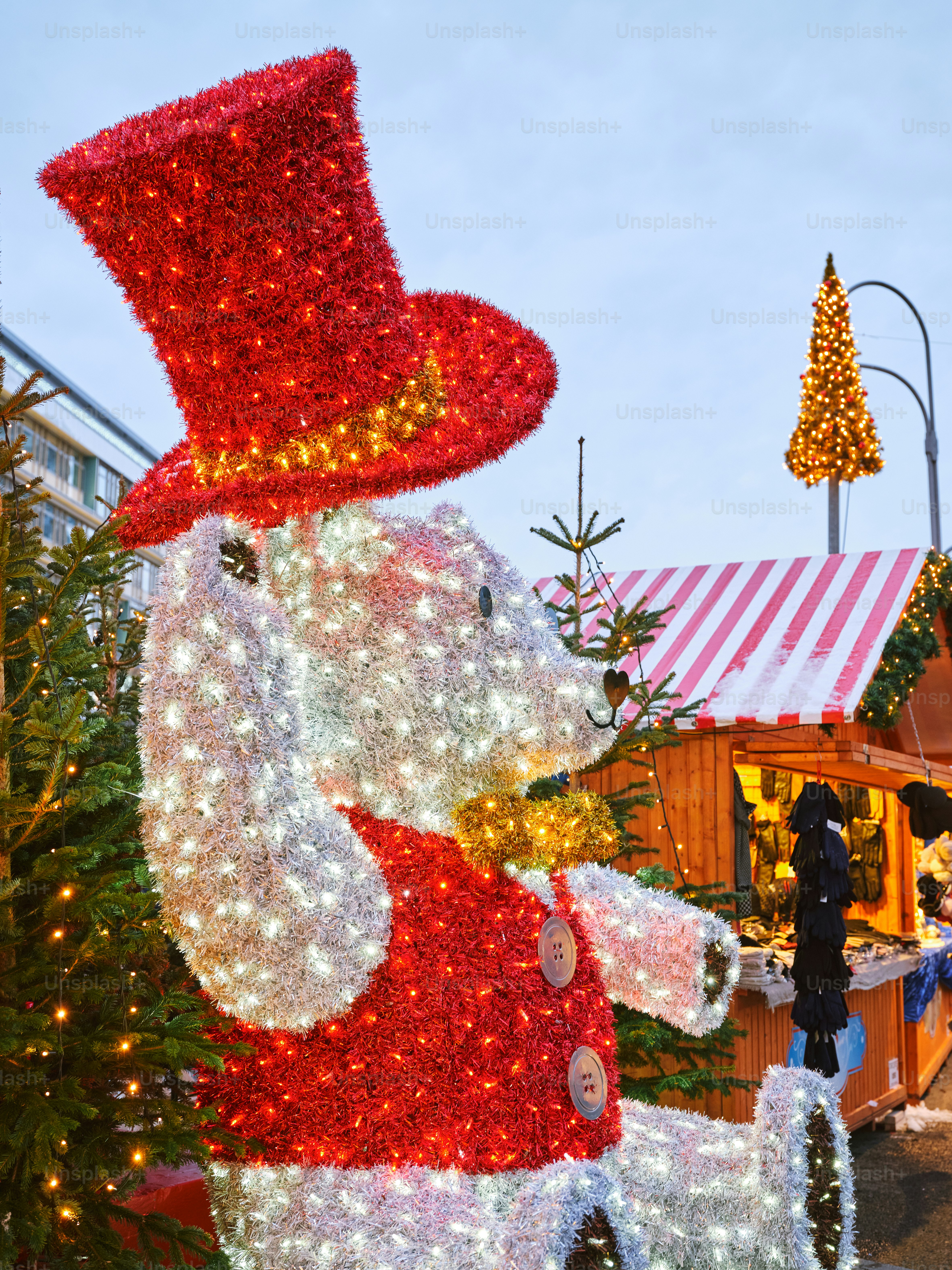 a large christmas decoration of a dog wearing a top hat