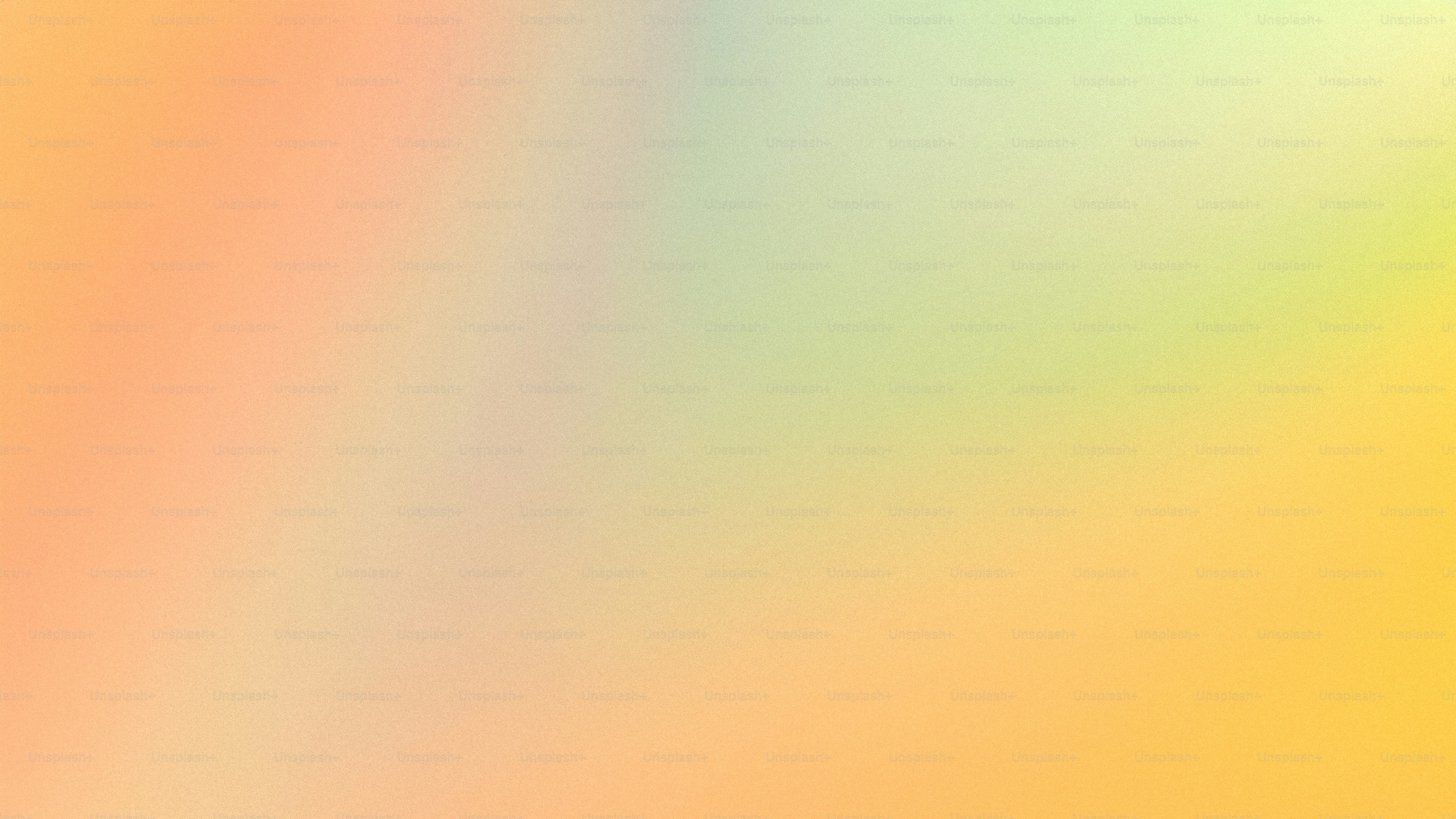 a blurry image of a yellow and pink background