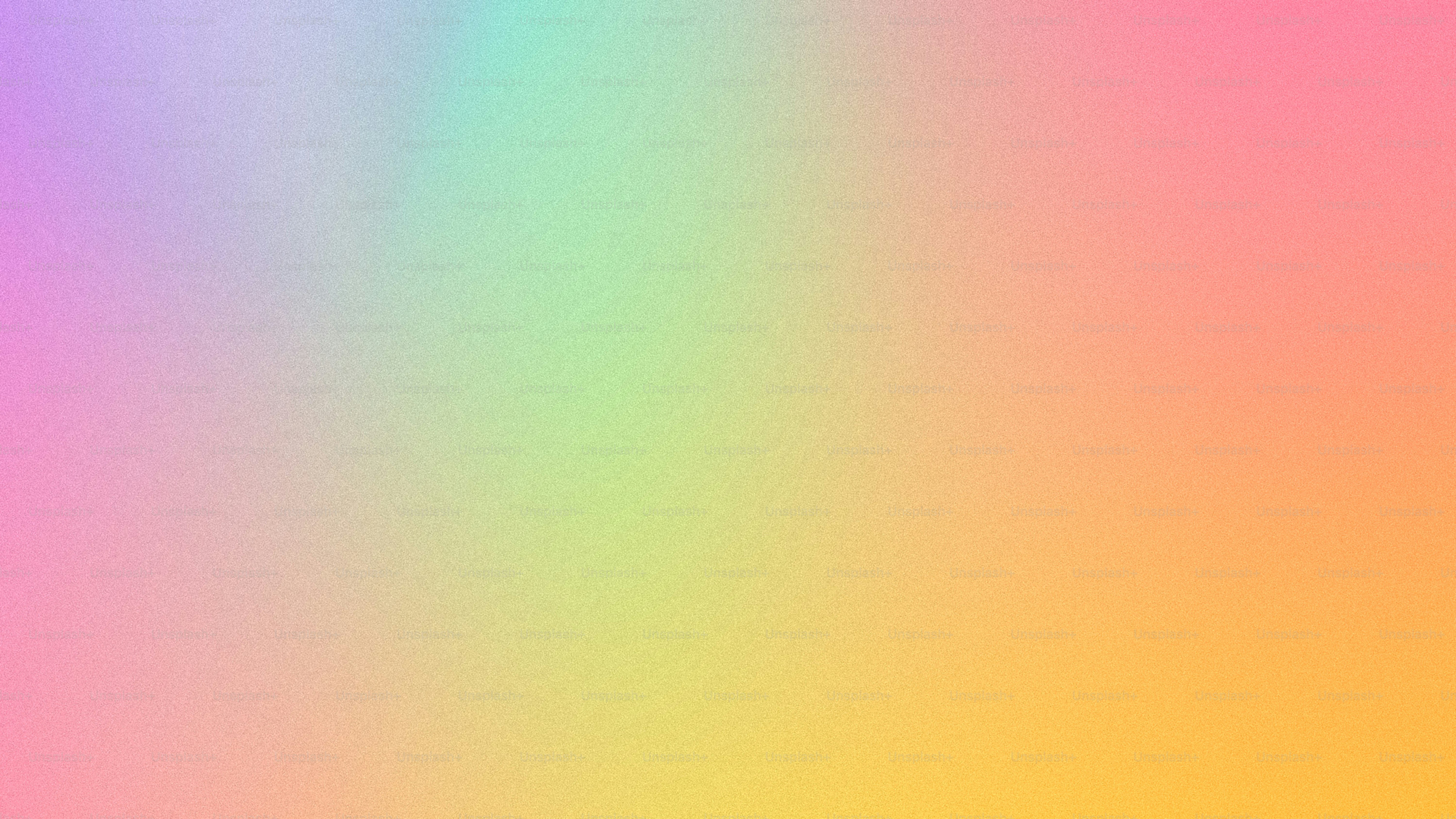 a blurry image of a rainbow colored background