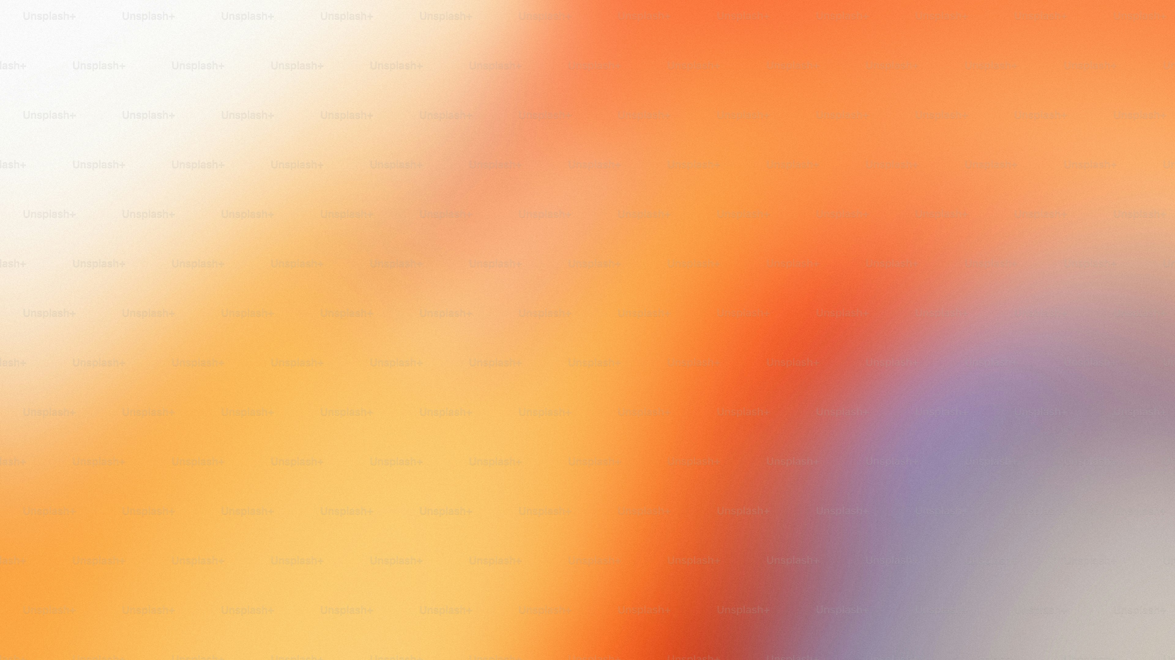ein verschwommenes Bild mit einem orangefarbenen und blauen Hintergrund