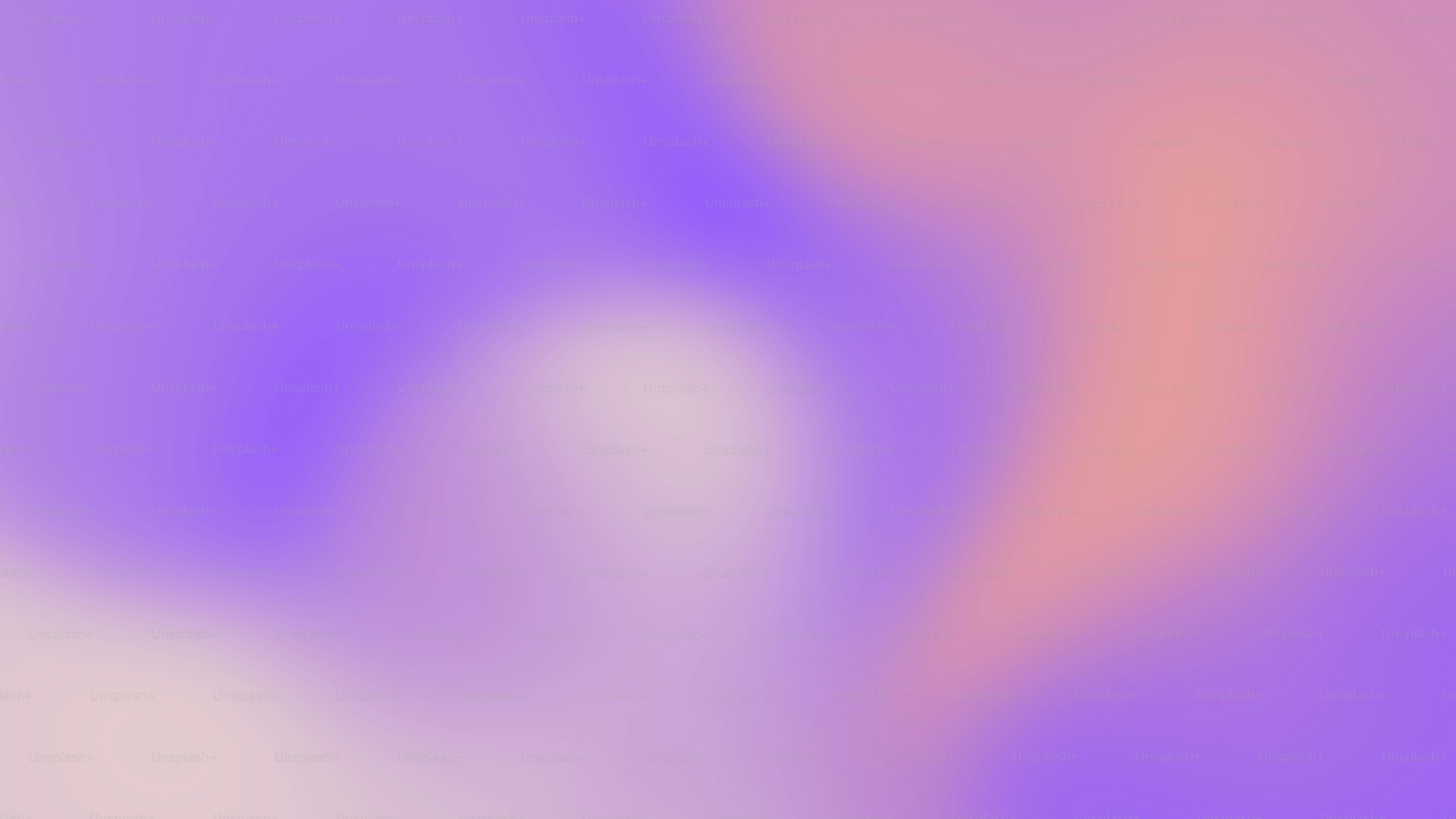 una imagen borrosa de un fondo púrpura y naranja