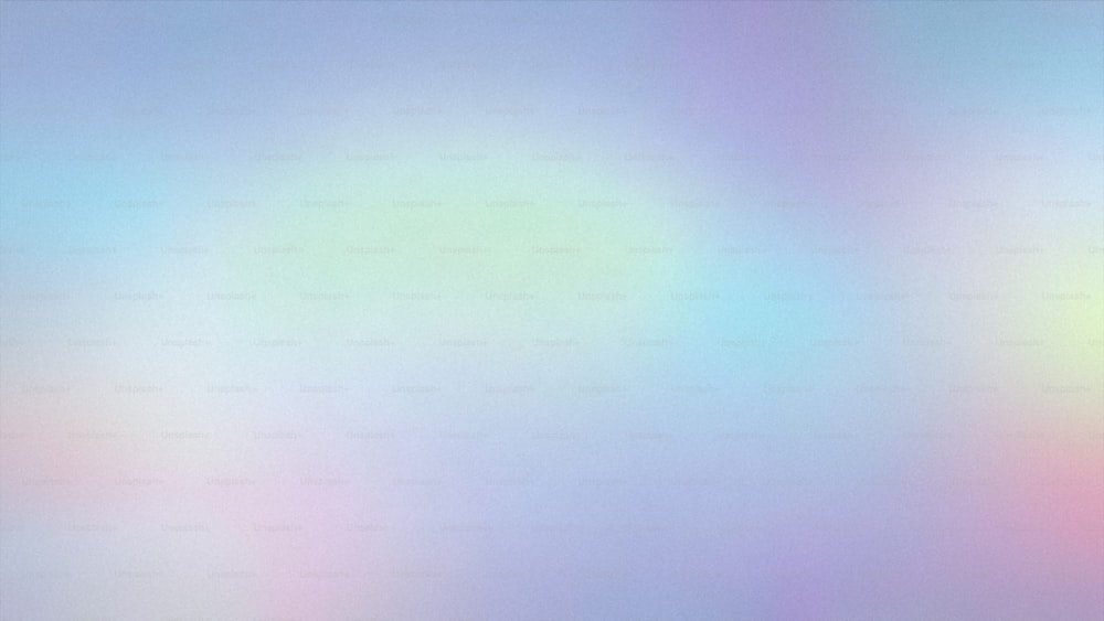 a blurry image of a blue, pink, and yellow background