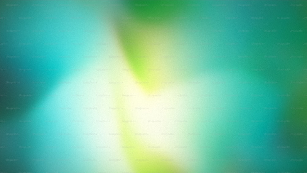 un'immagine sfocata di uno sfondo verde e blu