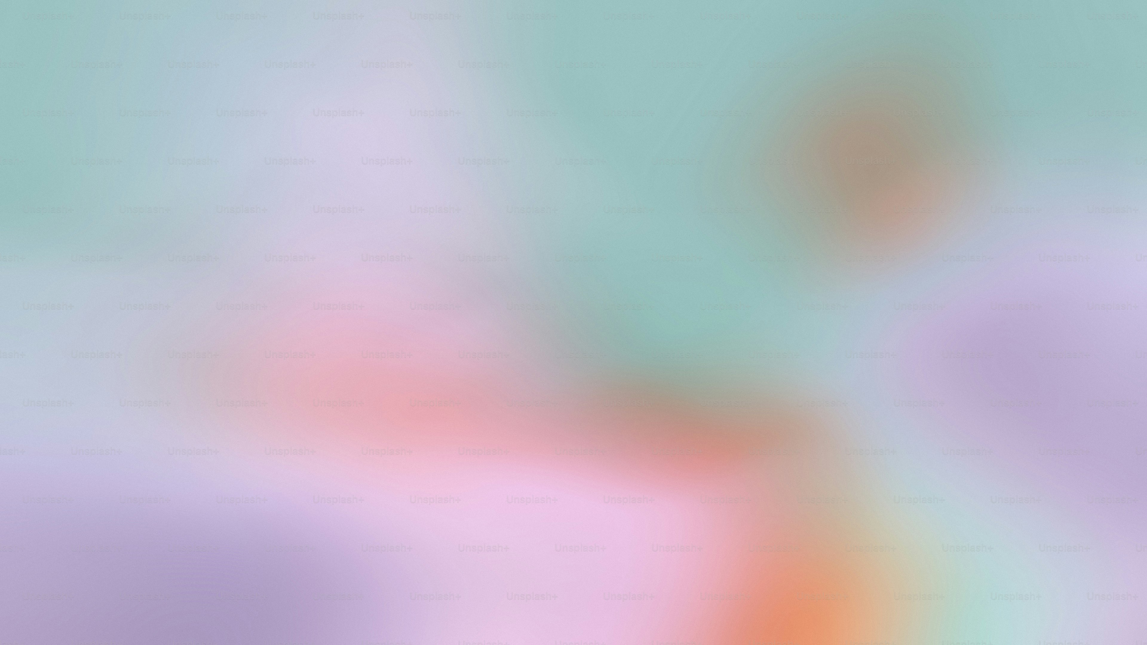 a blurry image of a pink and blue background