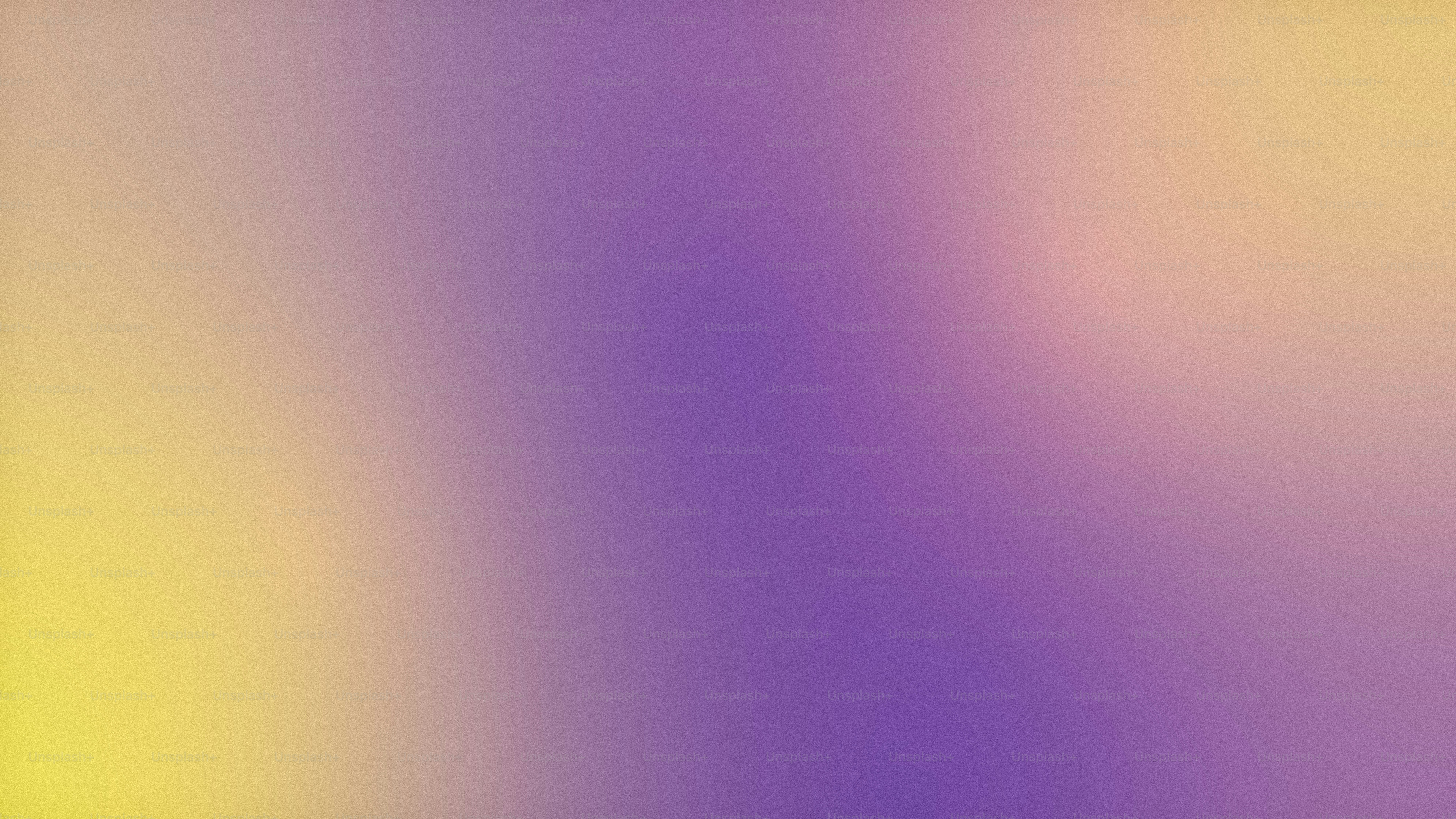 une image floue d’un arrière-plan jaune et violet