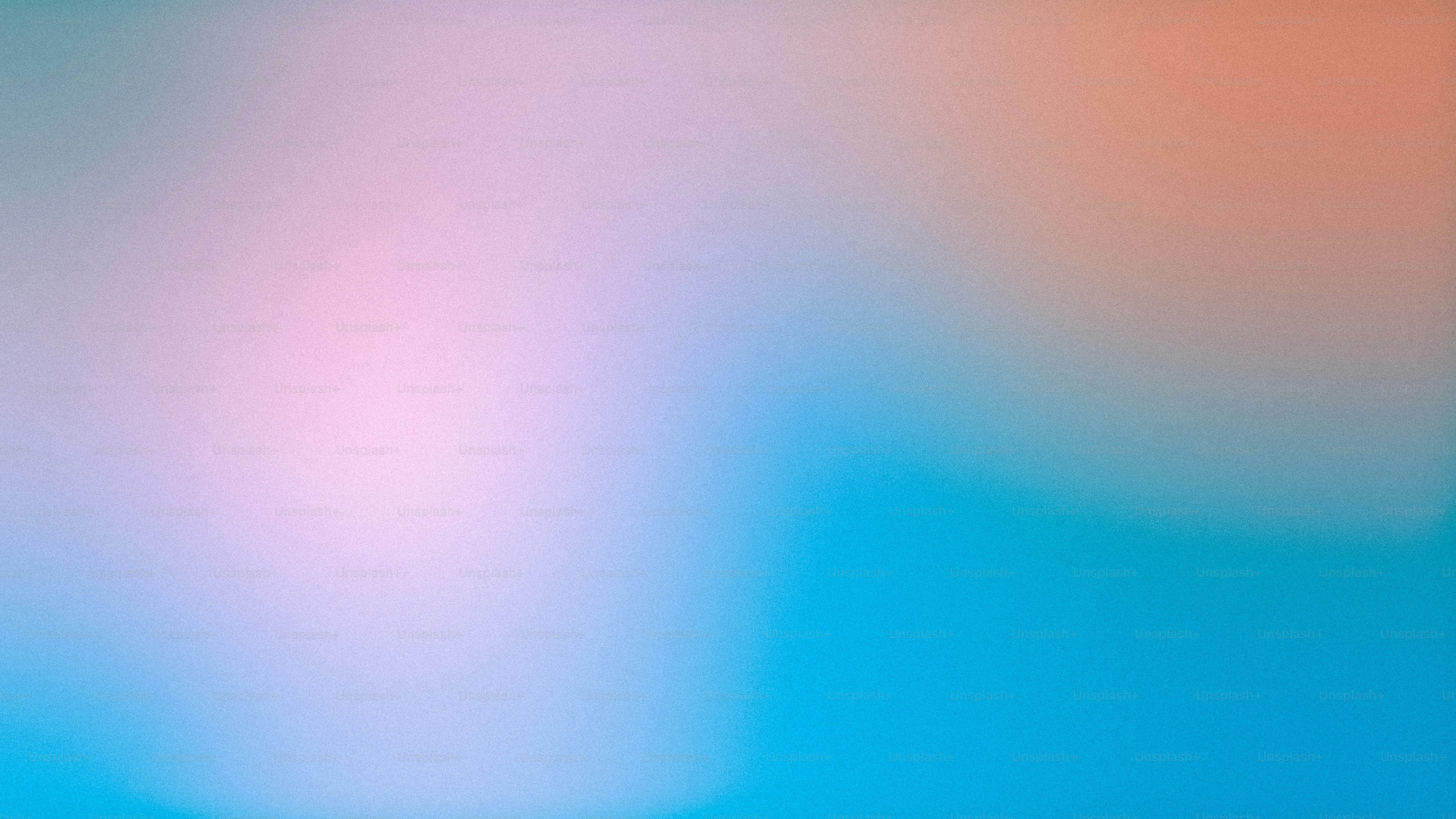 a blurry image of a blue and pink background