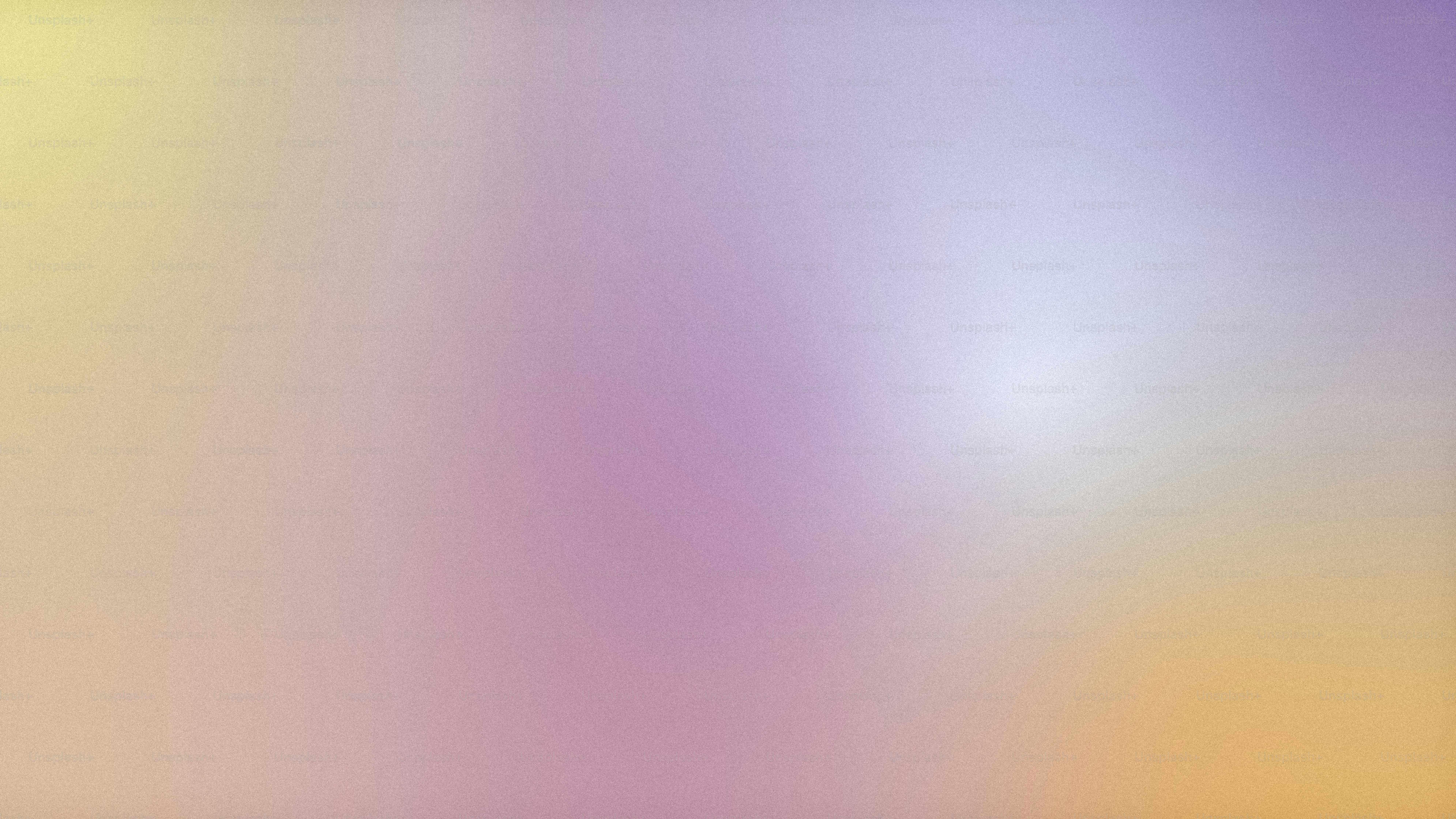 a blurry image of a yellow and purple background