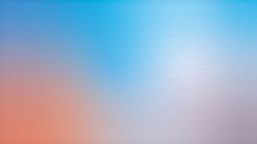 uma imagem desfocada de um fundo azul e laranja