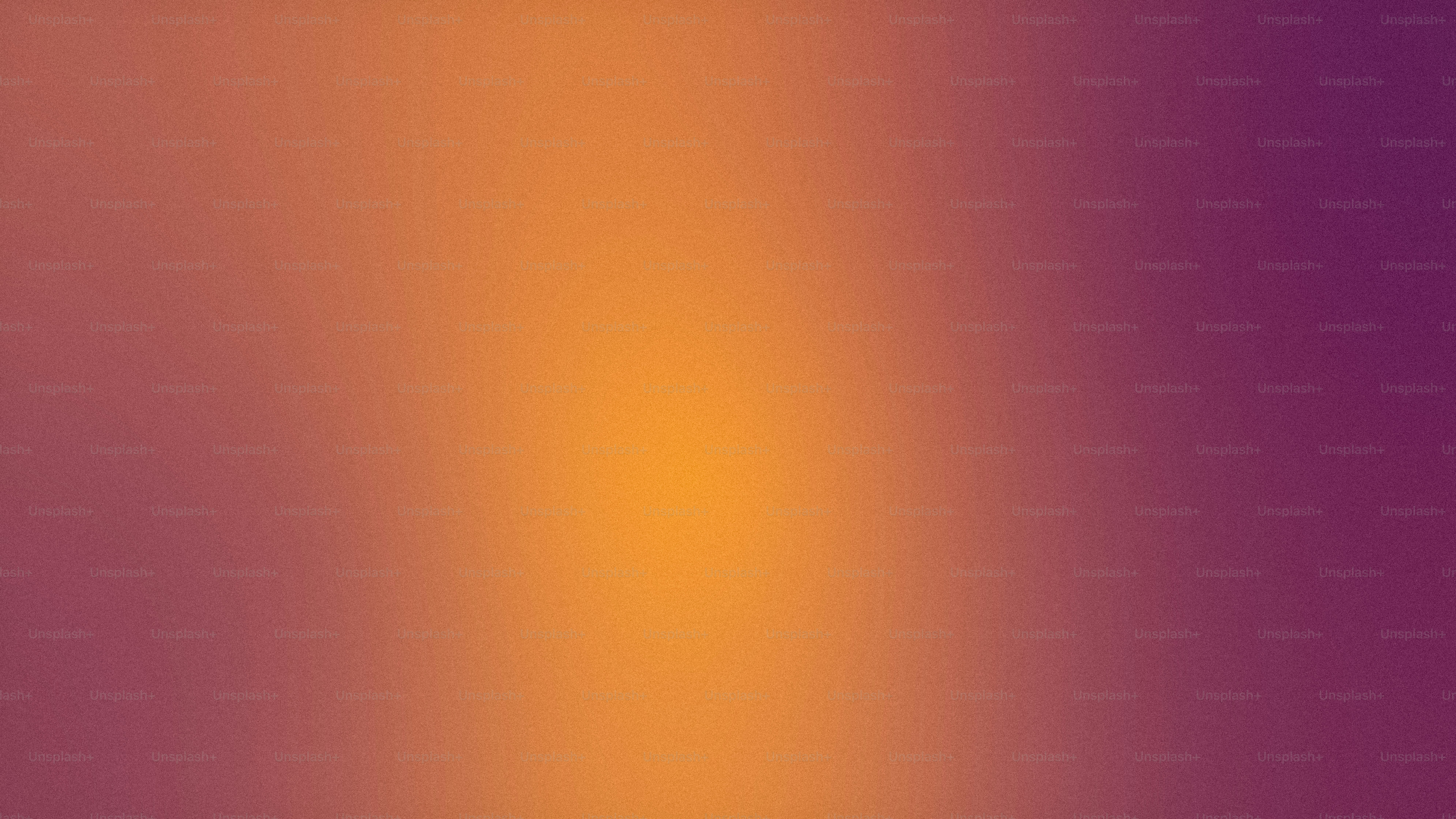 une image floue d’un arrière-plan violet et orange