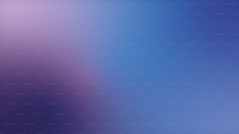 uma imagem desfocada de um fundo azul e roxo