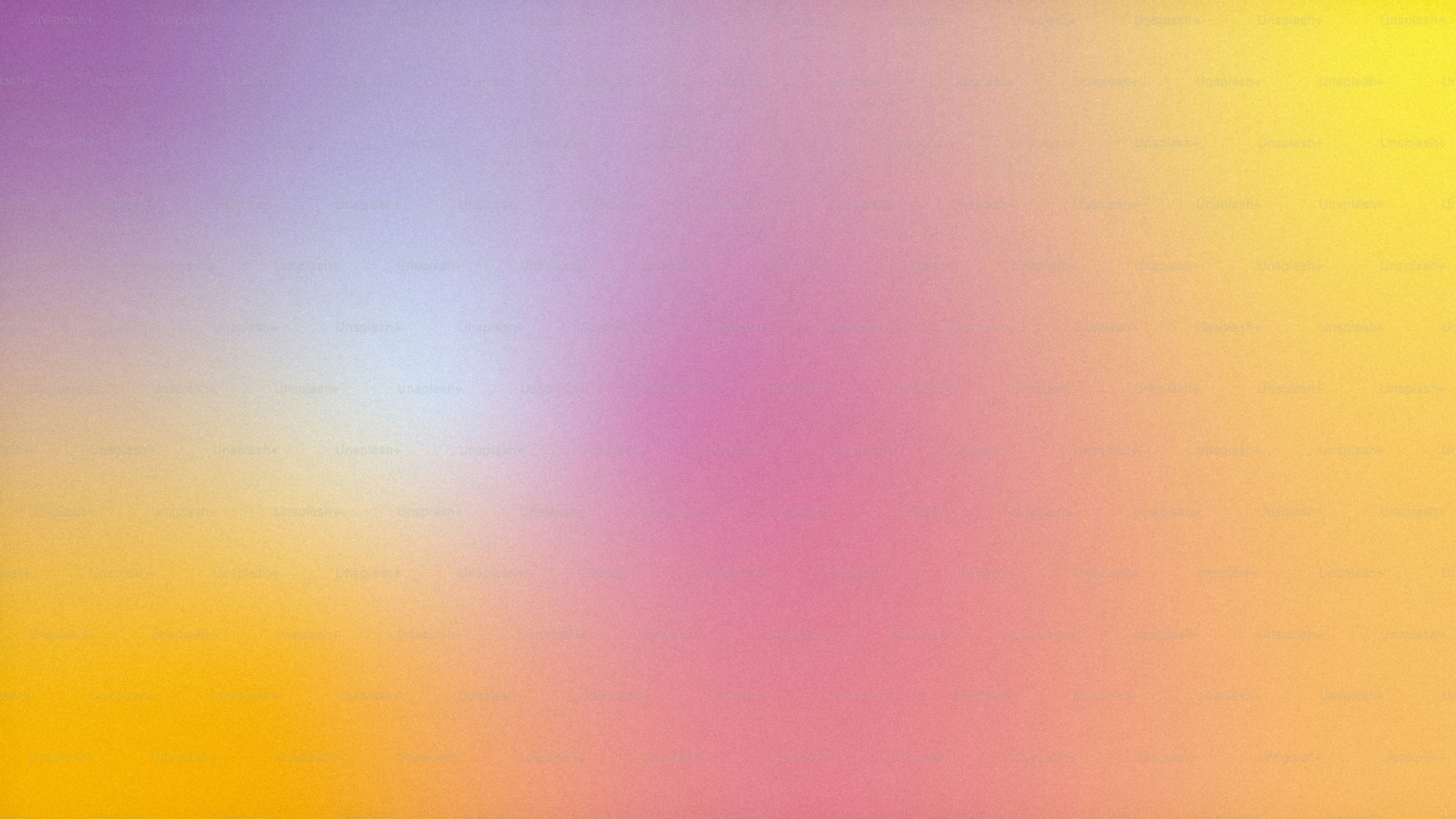 a blurry image of a yellow and purple background