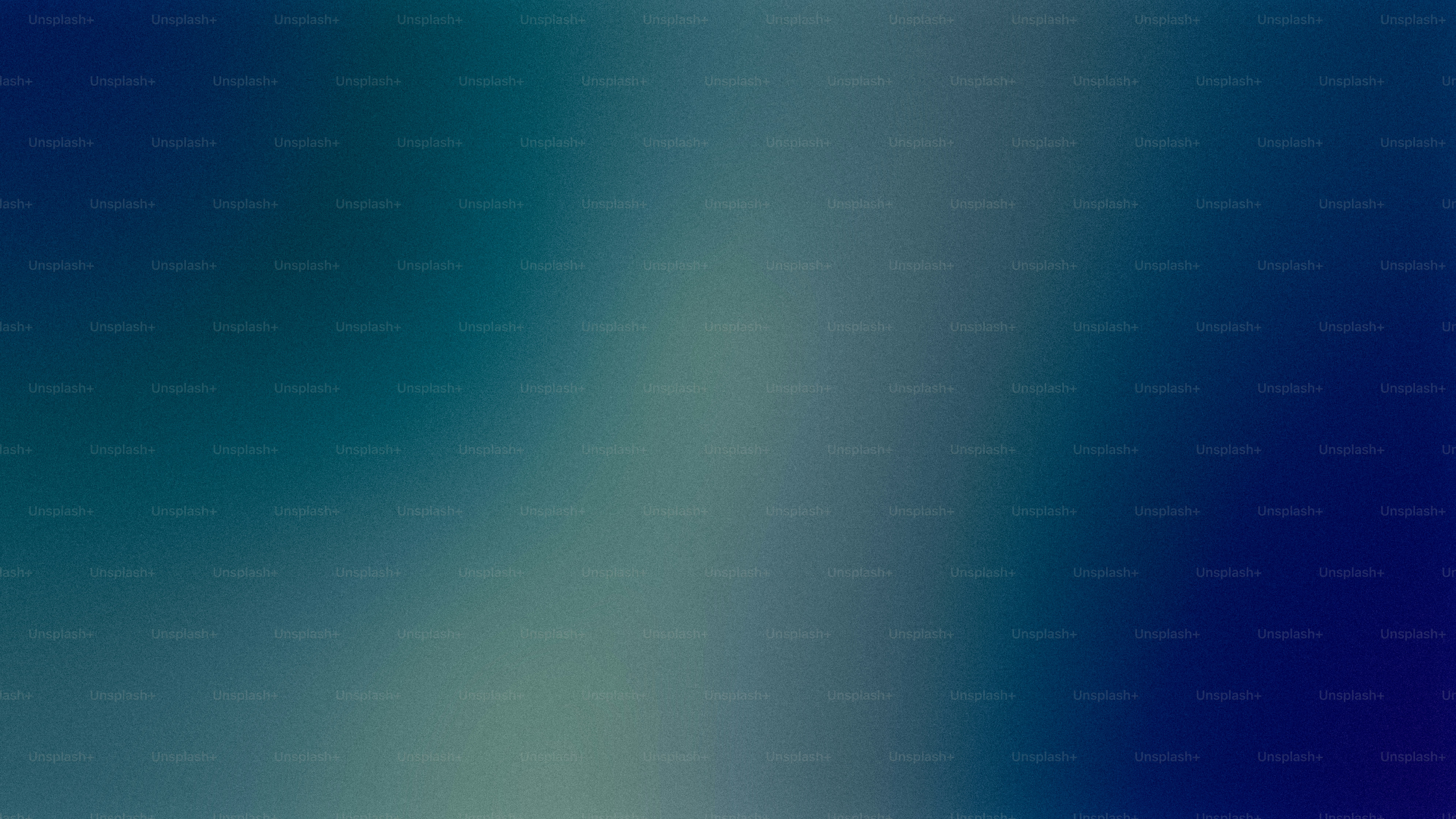 a blurry image of a blue and green background