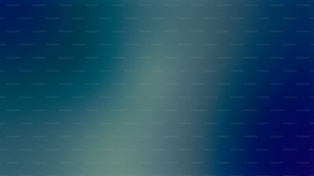 uma imagem desfocada de um fundo azul e verde