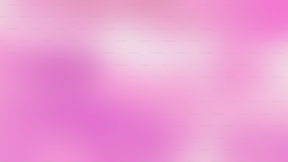 ein verschwommenes Bild mit rosafarbenem Hintergrund