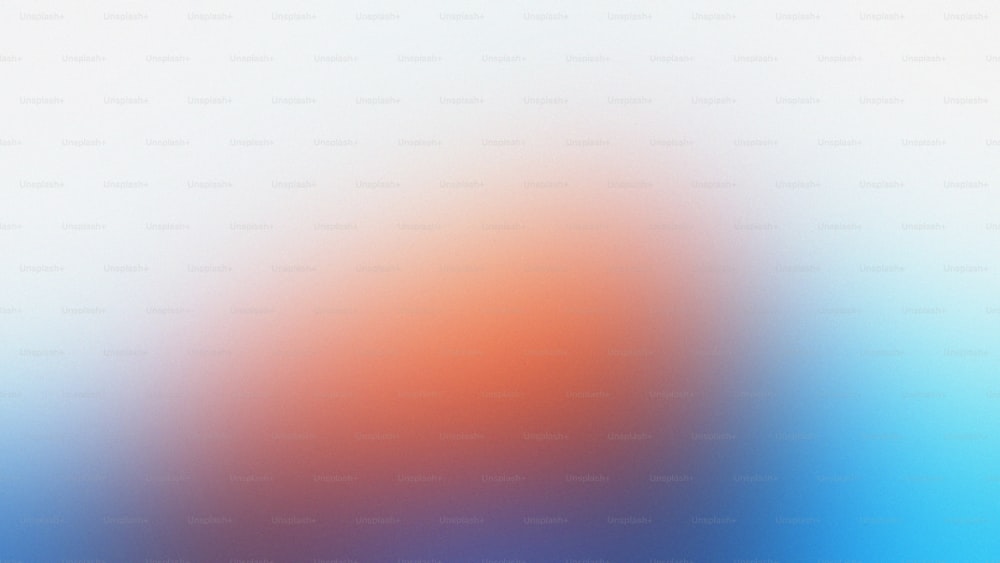 une image floue d’un arrière-plan orange et bleu