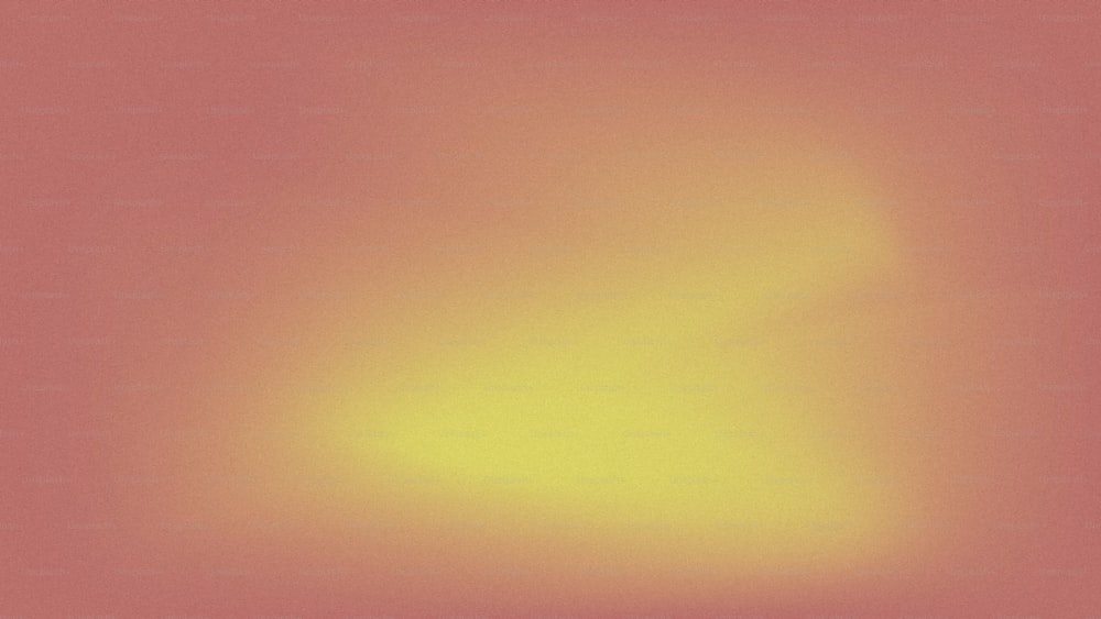 a blurry image of a yellow and pink background