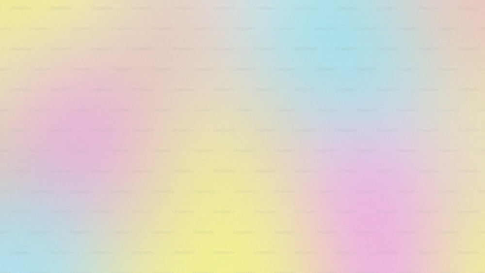 a blurry image of a pink and blue background