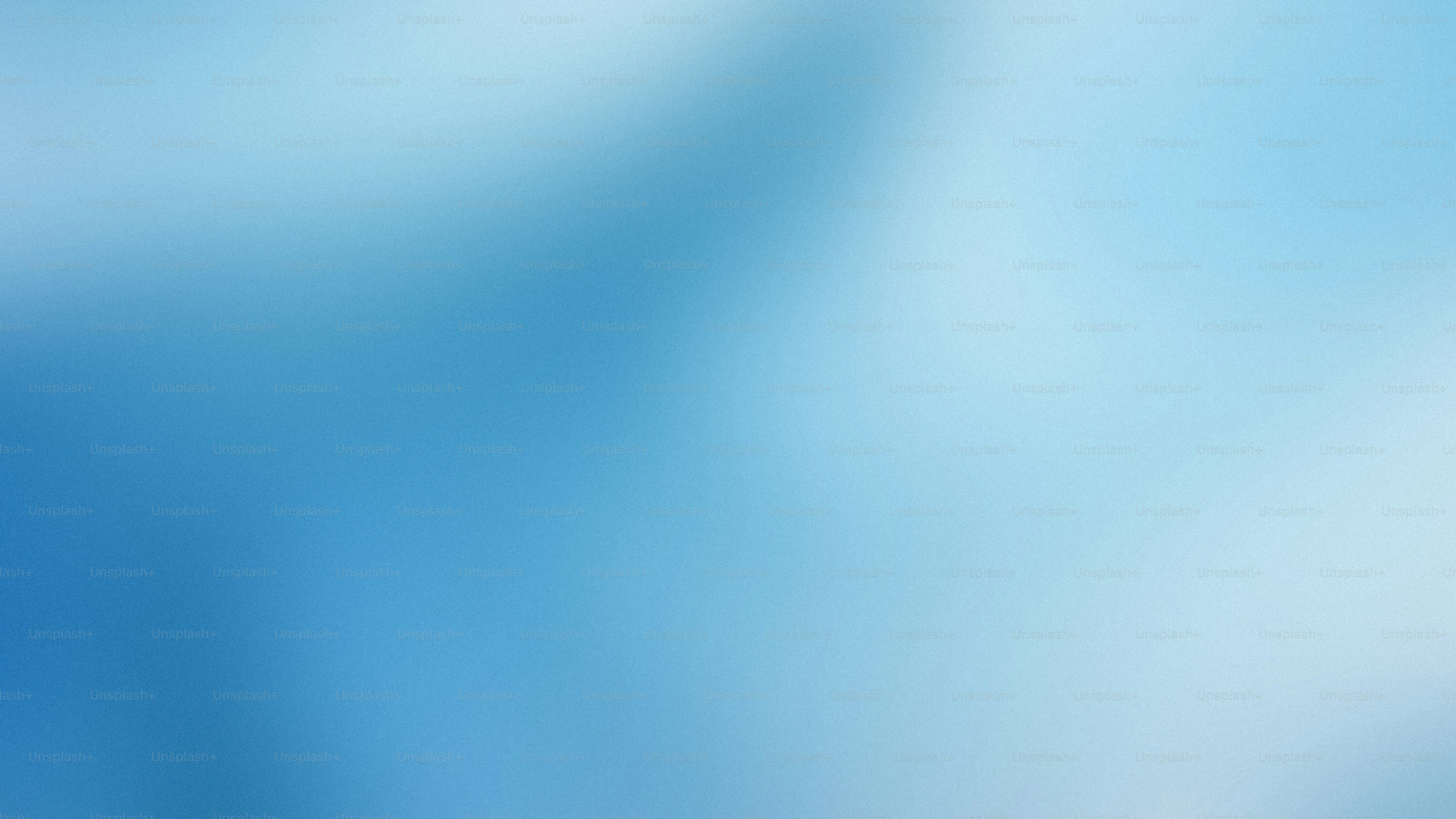 a blurry image of a blue and white background
