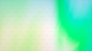 a blurry image of a green and white background