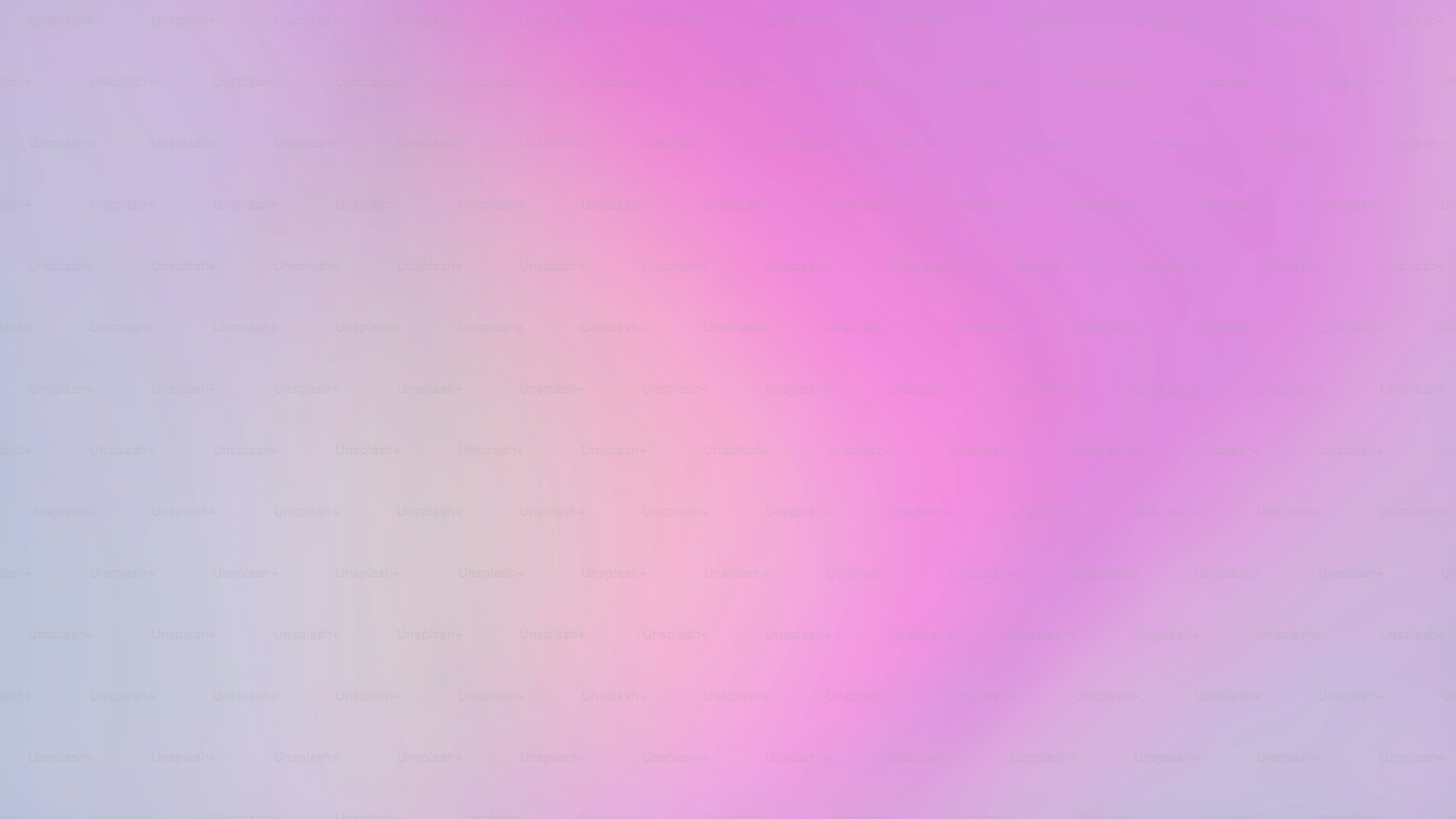 a blurry image of a pink and blue background