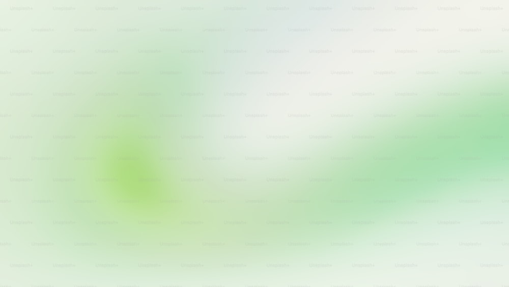 uma imagem desfocada de um fundo verde e branco