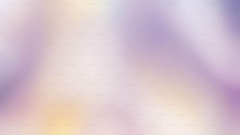 a blurry image of a purple and yellow background