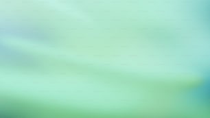 a blurry image of a green and blue background