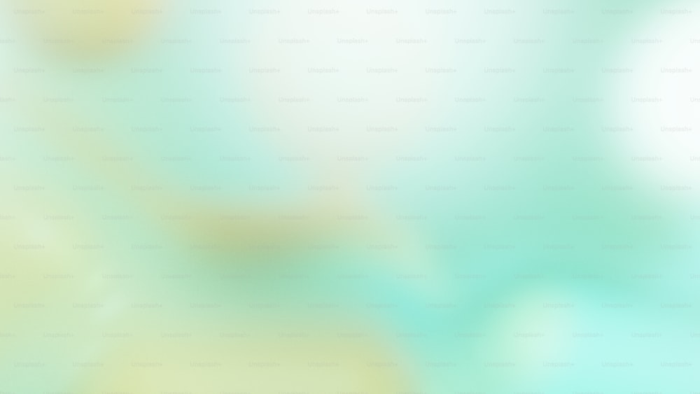 a blurry image of a green and yellow background