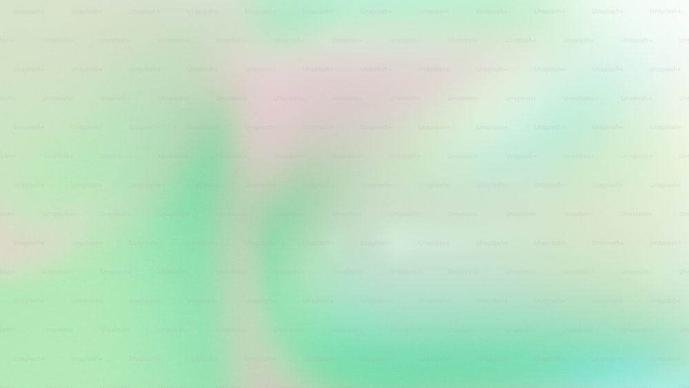uma imagem desfocada de um fundo verde e rosa