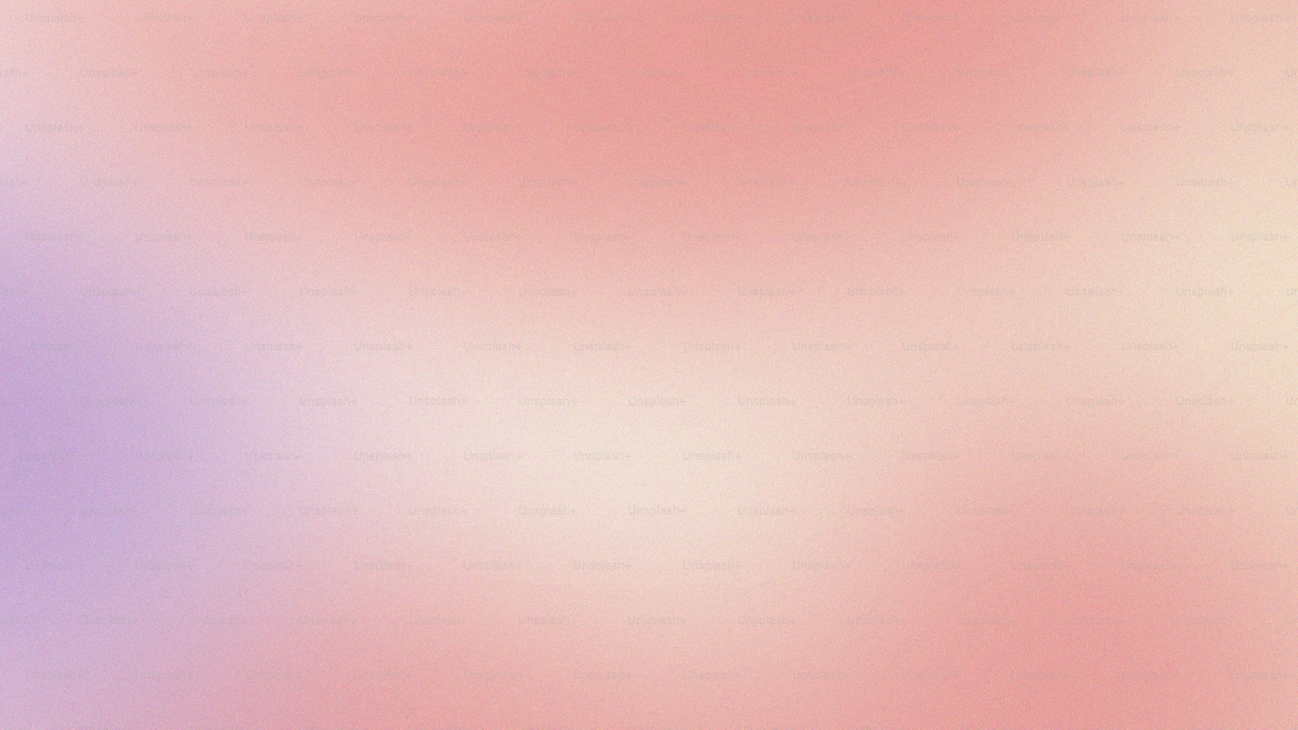 a blurry image of a pink and purple background
