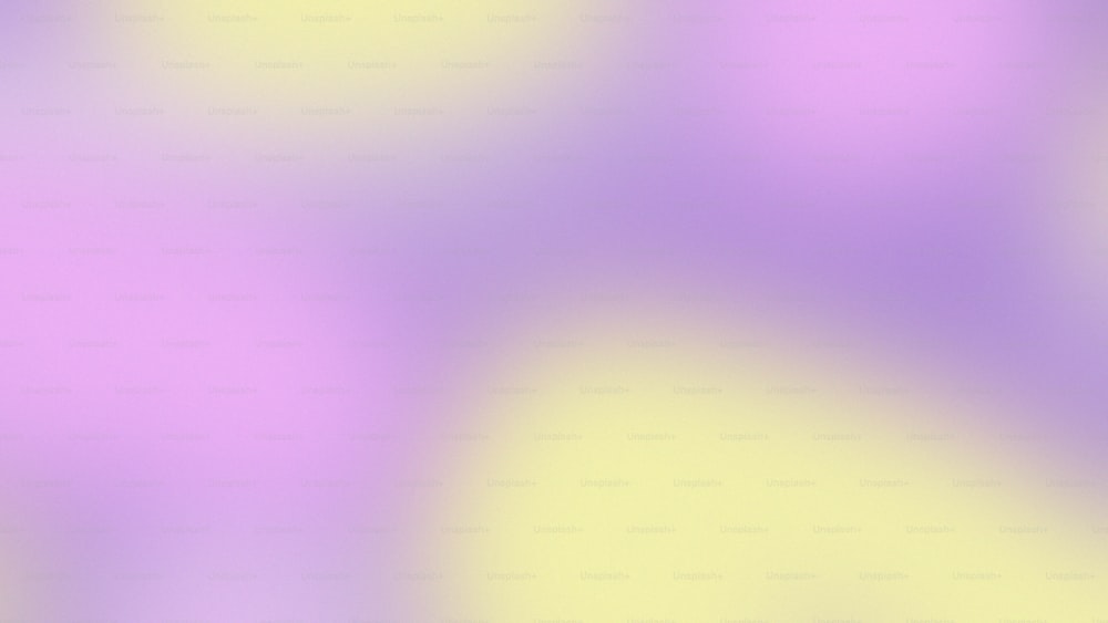 a blurry image of a yellow and purple background