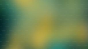 ein verschwommenes Bild mit grünem und gelbem Hintergrund