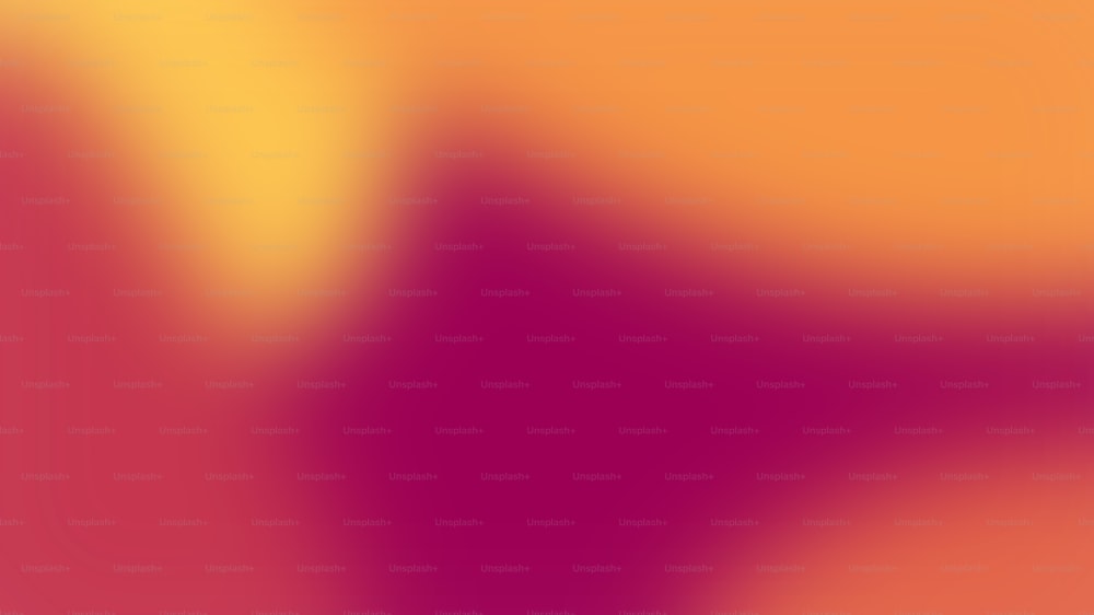 une image floue d’un arrière-plan orange et rose