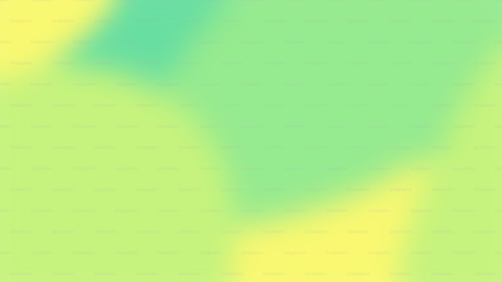 une image floue d’un fond vert et jaune