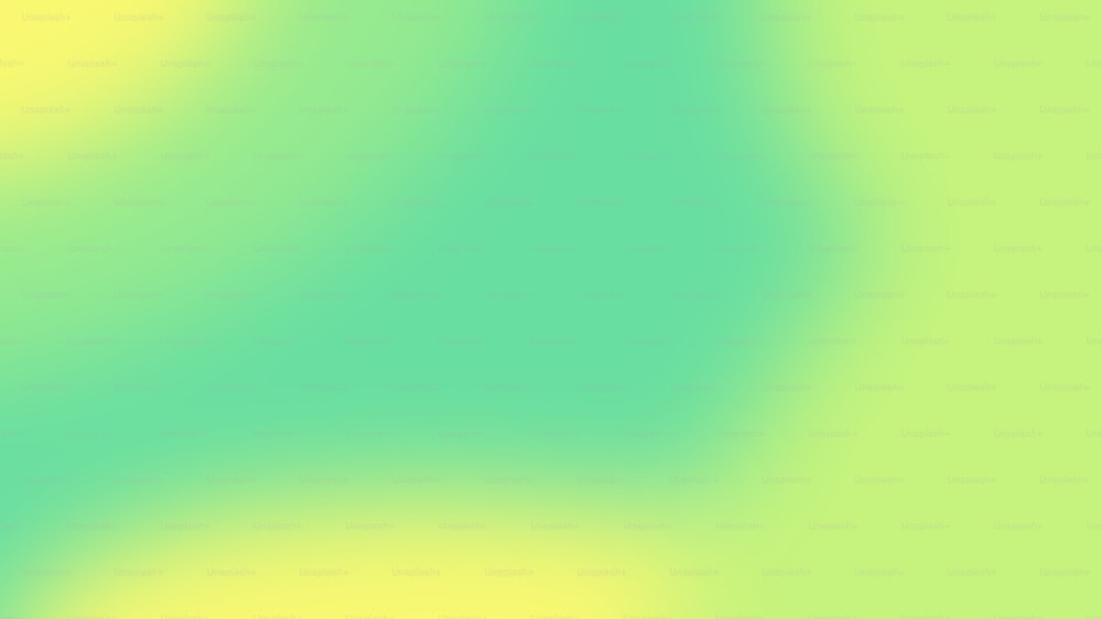 ein verschwommenes Bild mit grünem und gelbem Hintergrund