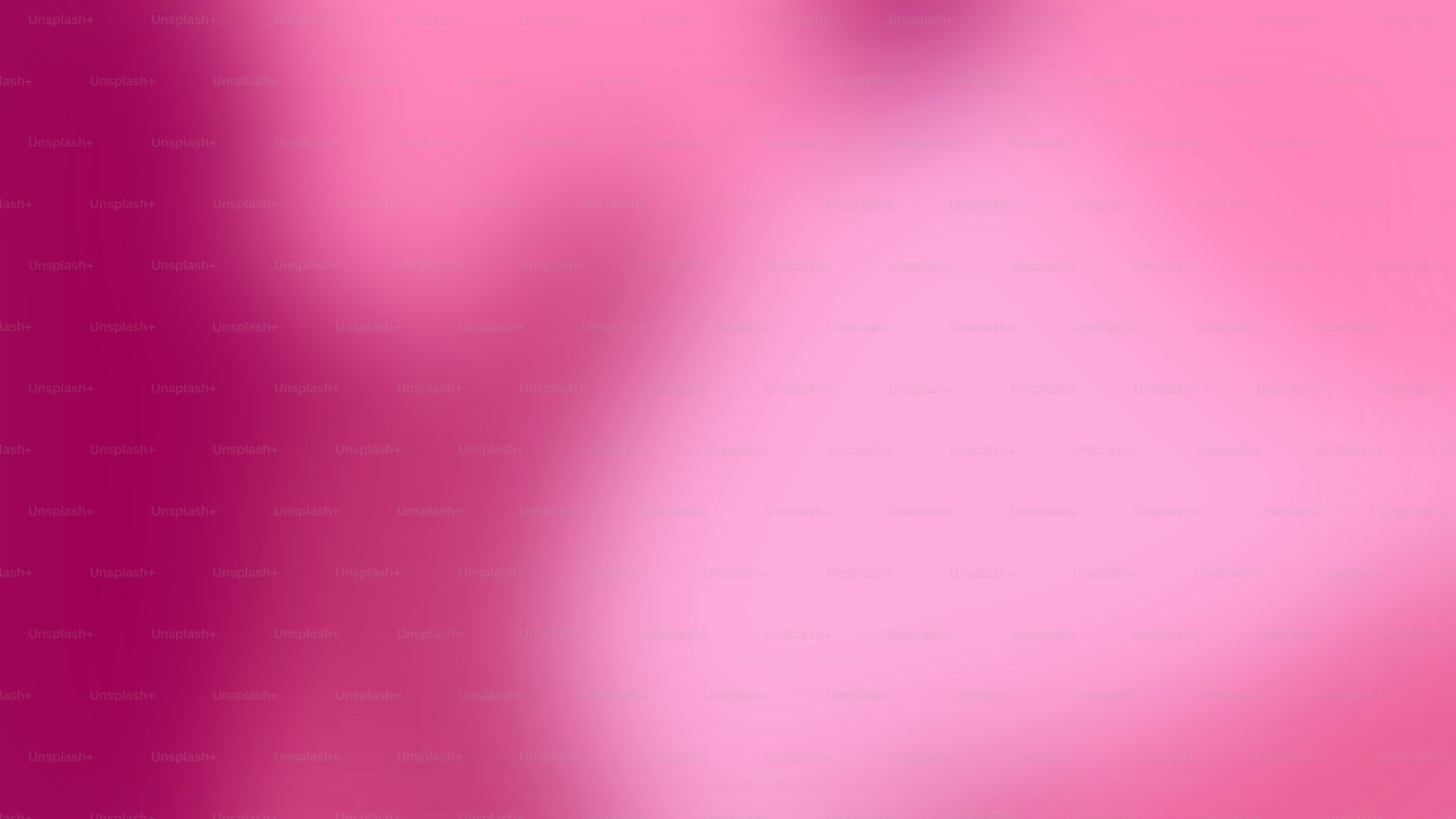 una imagen borrosa de un fondo rosa