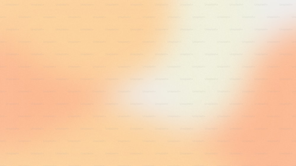 uma imagem desfocada de um fundo amarelo e laranja