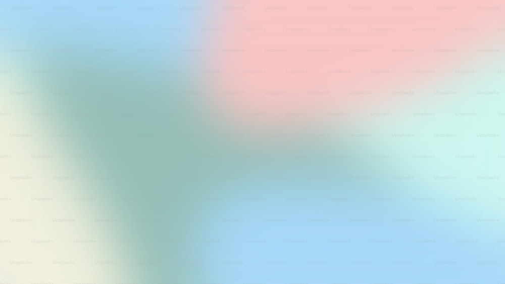 una imagen borrosa de un fondo azul y rosa
