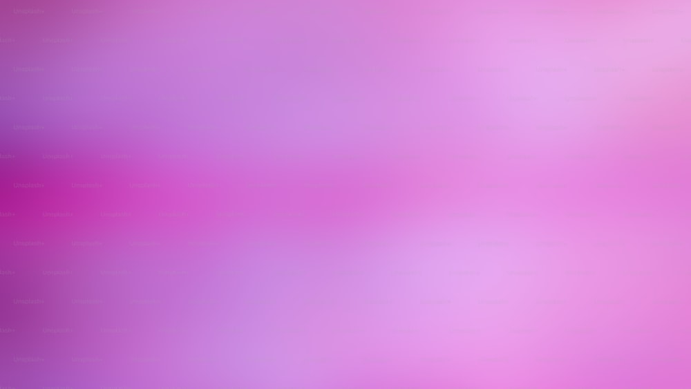 a blurry image of a pink and purple background